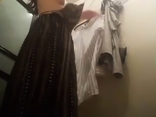 Dressing room voyeur spies on a sexy slender Oriental teen