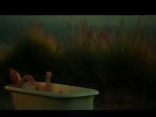 Redhead beautiful model teasing in tub