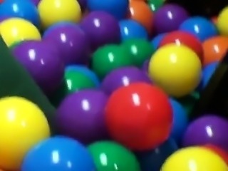 College couple get frisky in playpen of balls